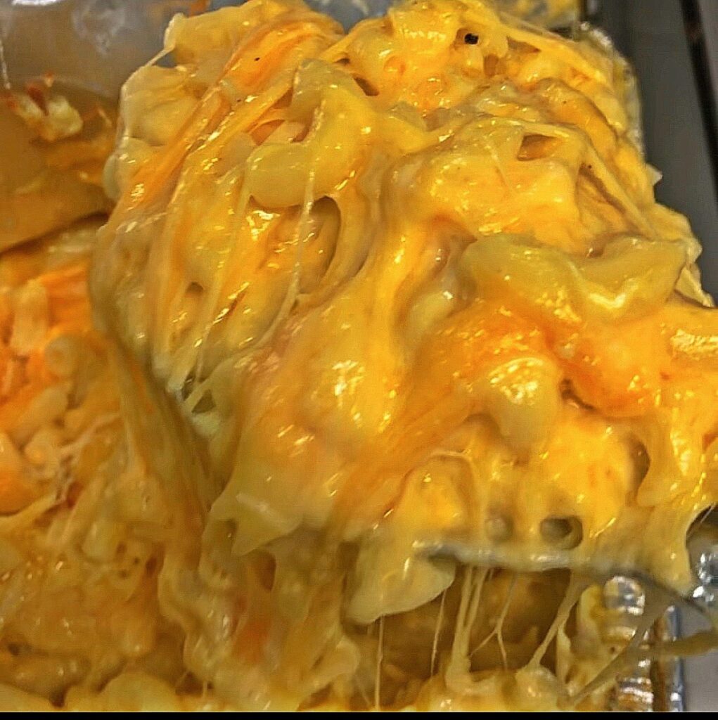 A close up of some cheese covered food